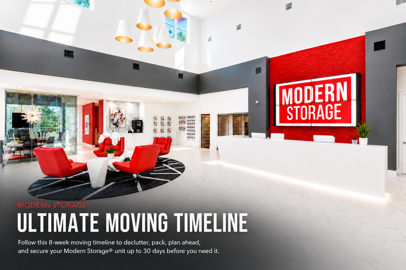 Bright, modern Modern Storage® lobby with red lounge chairs, a white reception desk, and a large illuminated logo behind the moving timeline text.