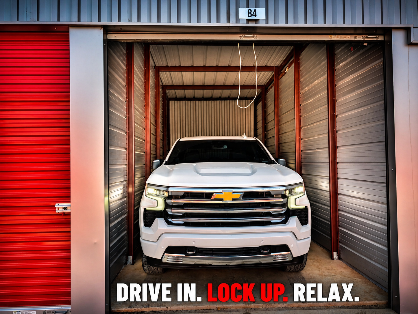 Full-size pickup truck parked inside a Modern Storage vehicle storage unit with convenient drive-up access.